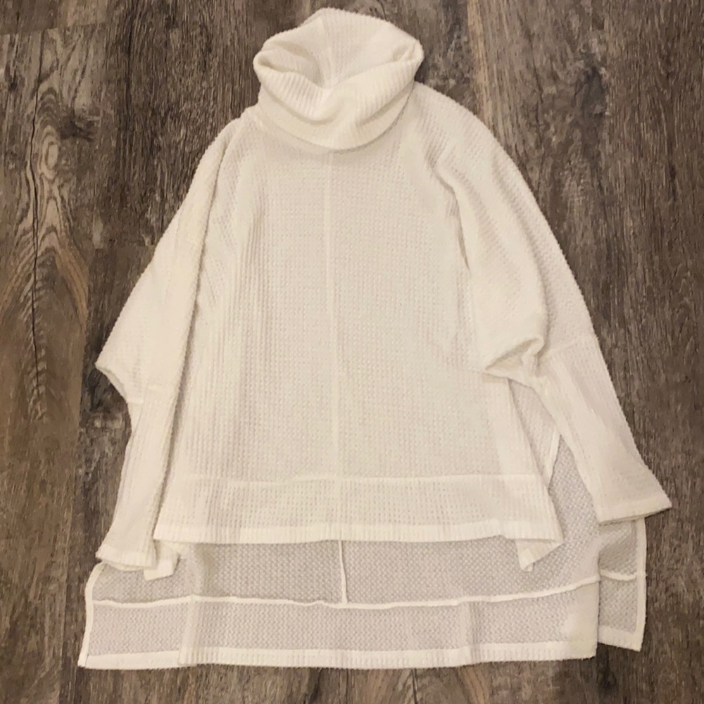 White high-low turtleneck sweater